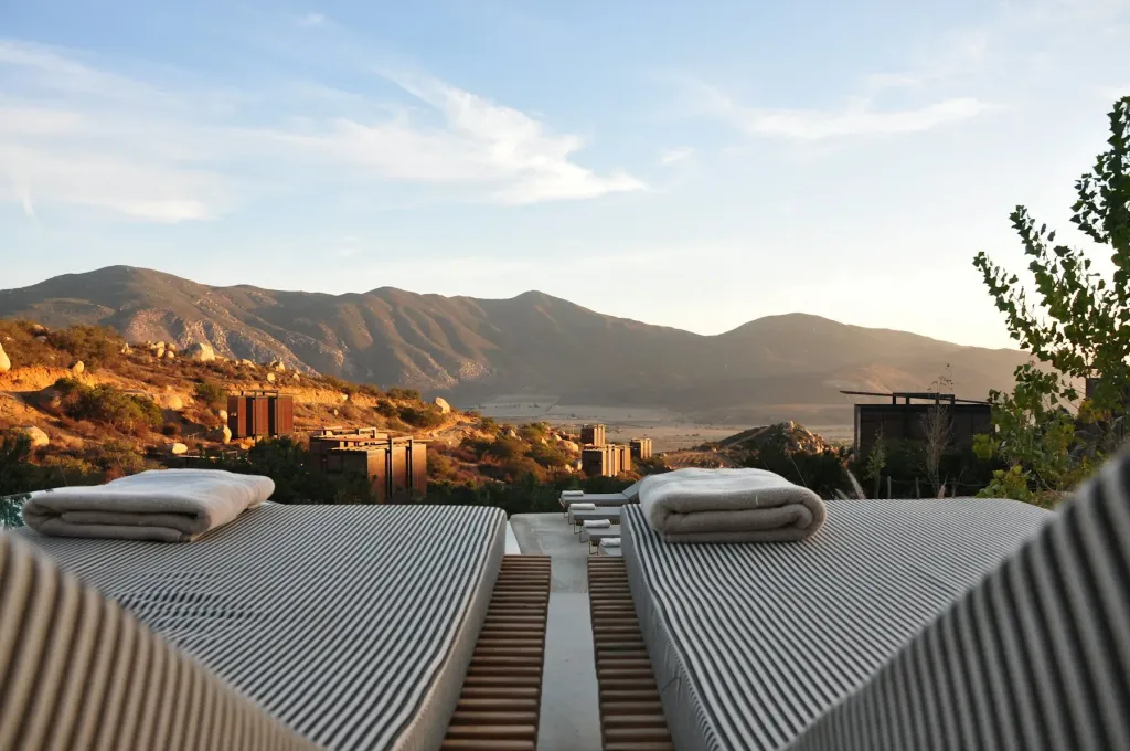 Two sun loungers on a terrace facing the mountains
