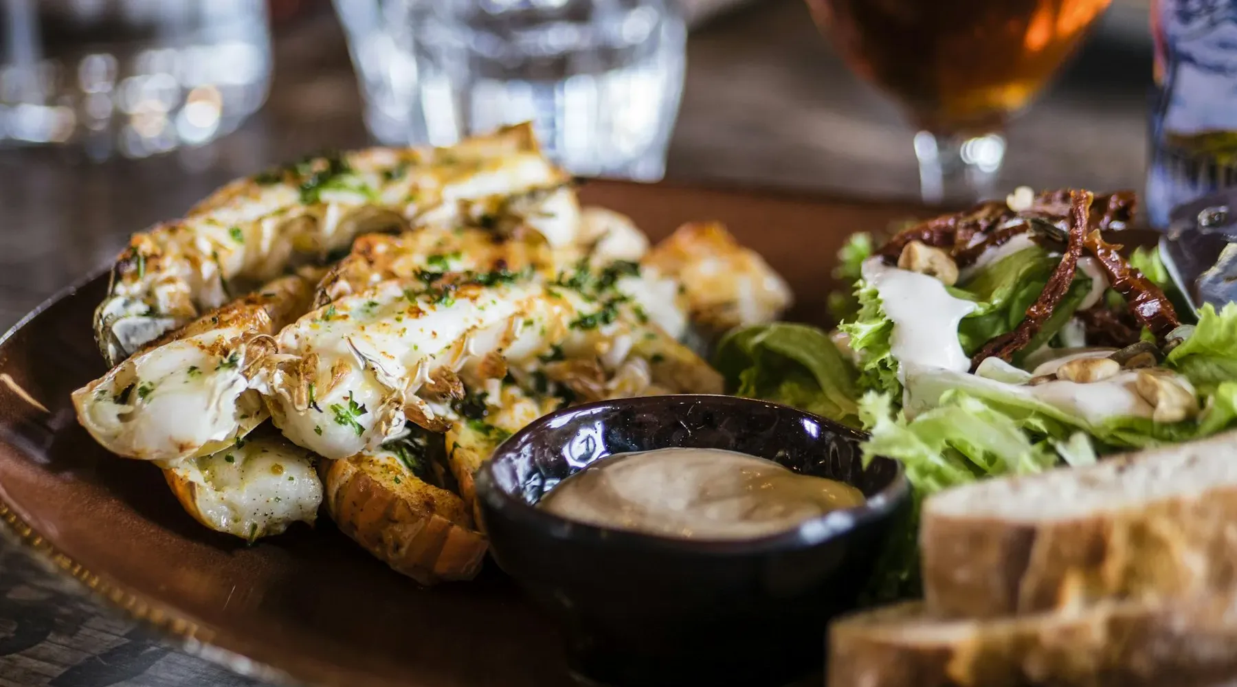 Grilled halloumi, salad and bread on a restaurant table