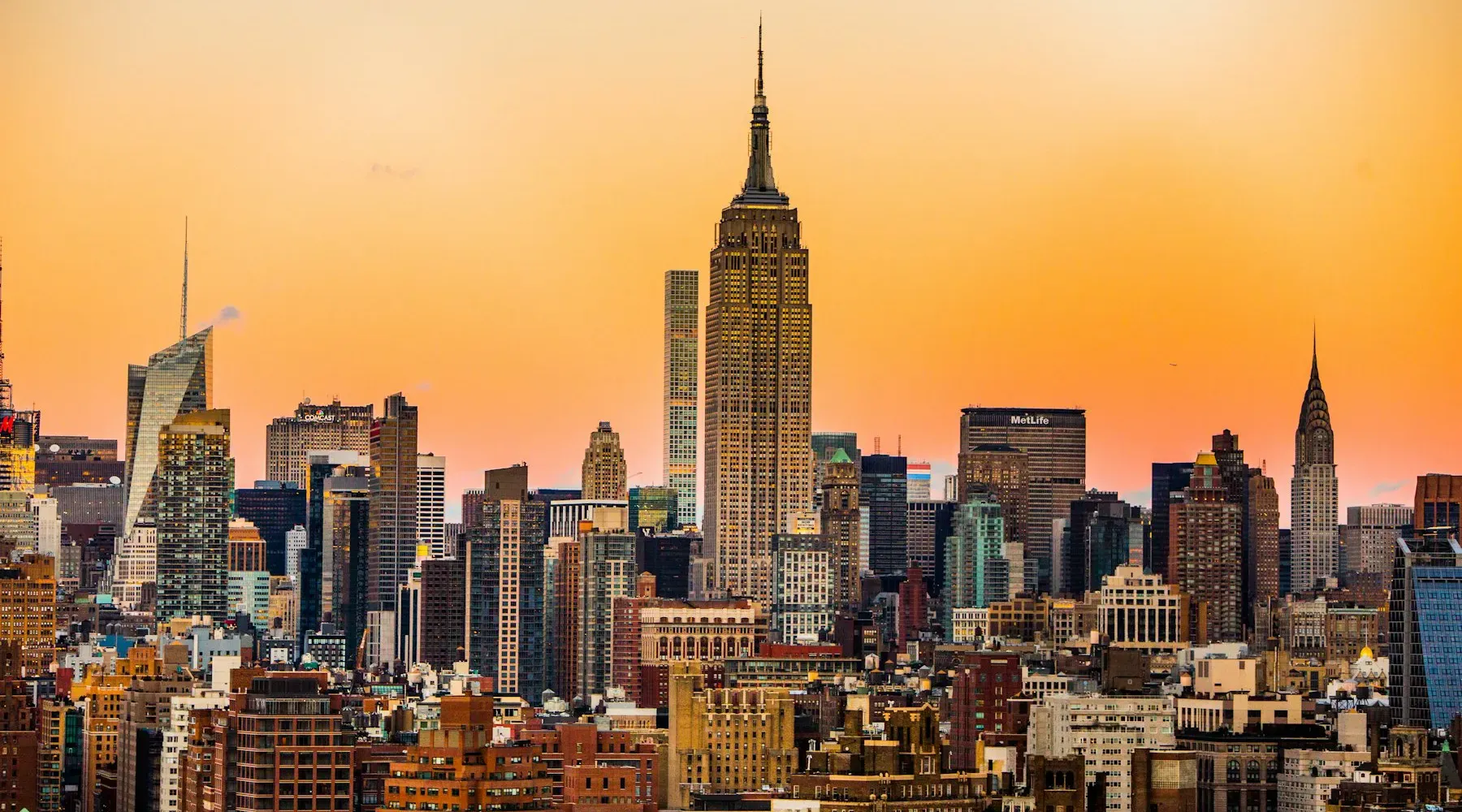 Manhattan skyline with the Empire State Building at sunset