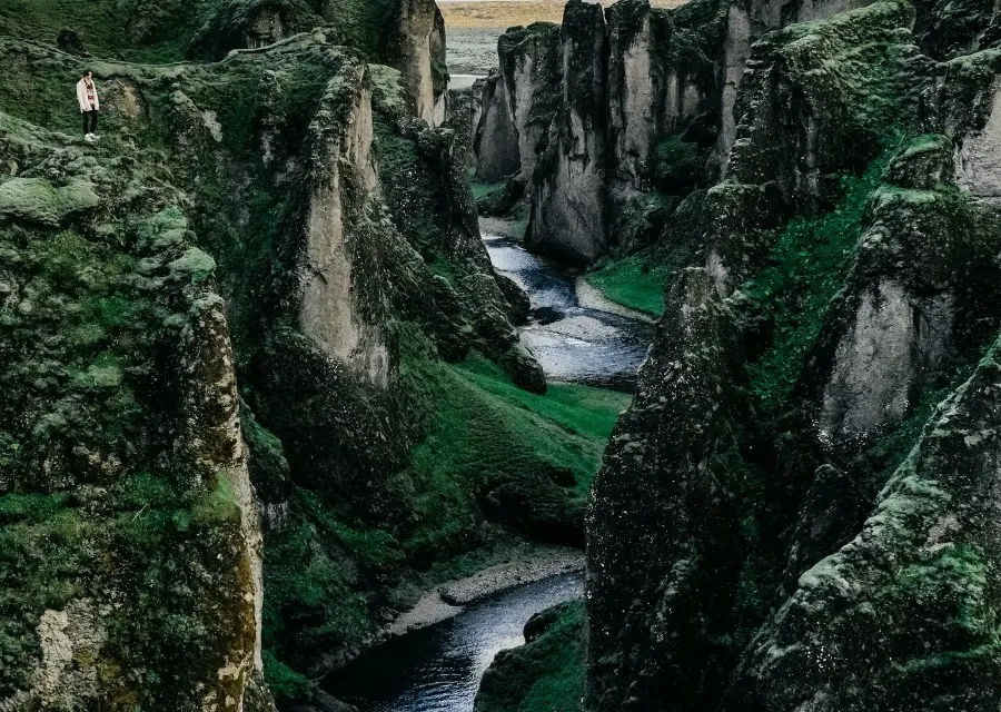 Mossy canyon with a winding river in Iceland