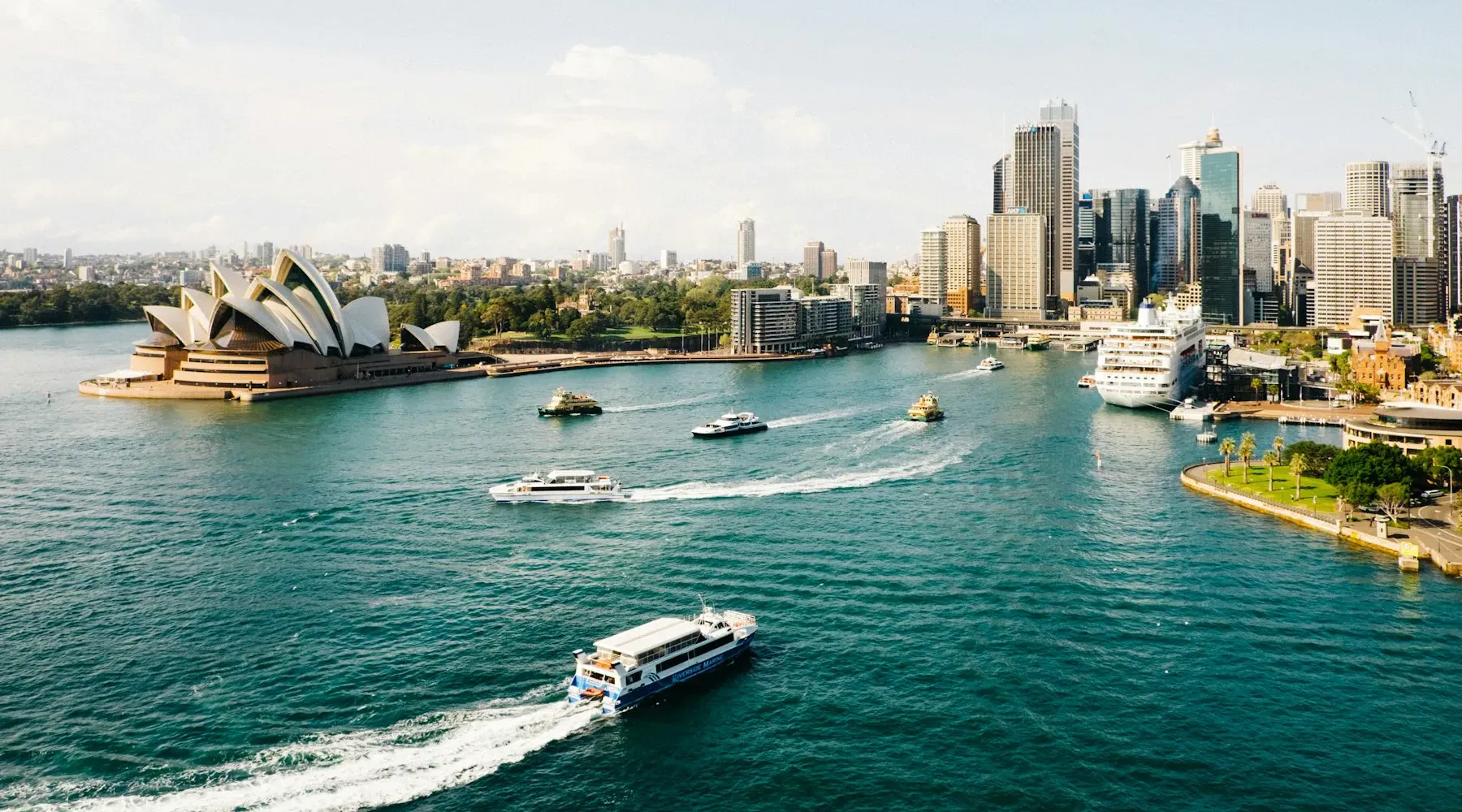 Sydney Opera House and harbor with ferries