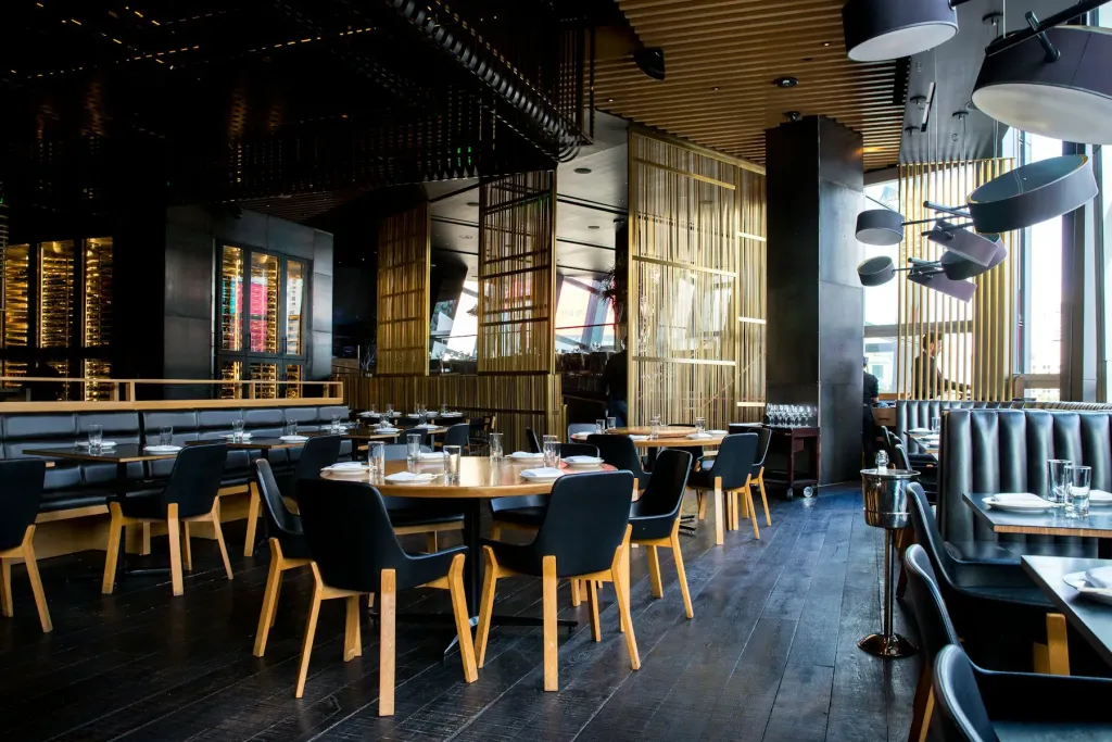 Modern restaurant dining room with wooden tables