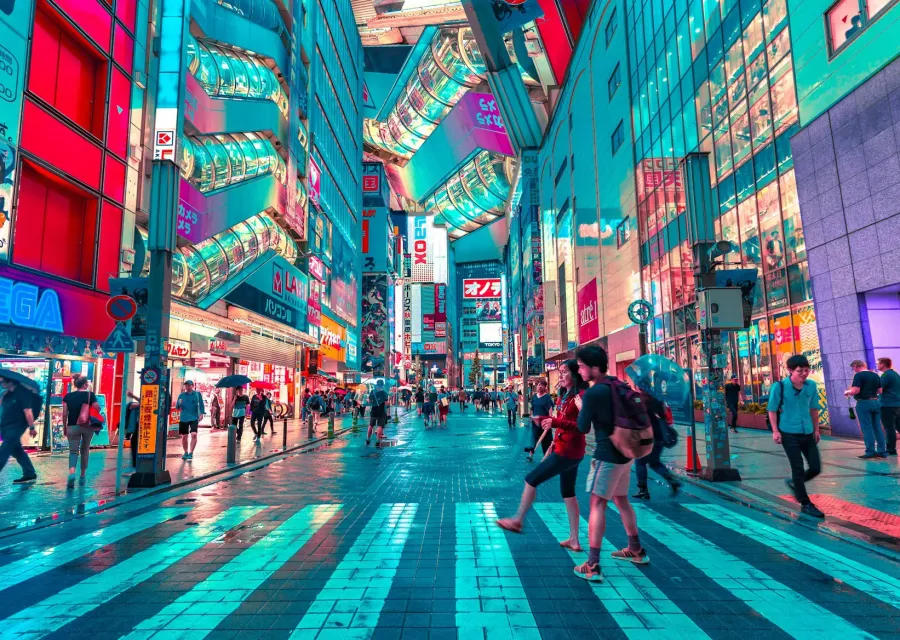 Neon-lit Tokyo shopping street with people crossing